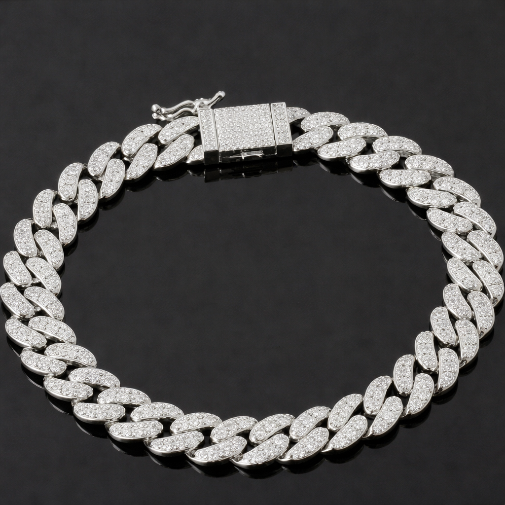 The VLTED 10mm Iced Cuban Link Bracelet, a silver bracelet encrusted with small, sparkling diamonds and finished with a rectangular clasp, is displayed on a black background in a circular shape.