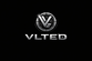 A metallic logo with a stylized V inside a circular emblem above the word VLTED in shiny silver letters on a black background. The letter E contains a small keyhole symbol.