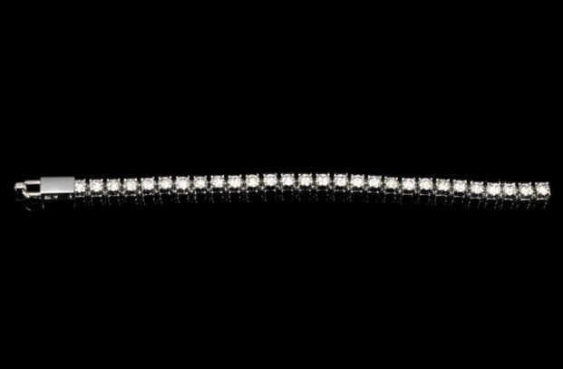 The VLTED 3mm Iced Tennis Chain features a row of sparkling micro-pavé cubic zirconia set in white metal, displayed on a black background.